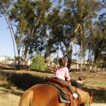 Paige & Kaylin riding Kisses with Grandma Carla